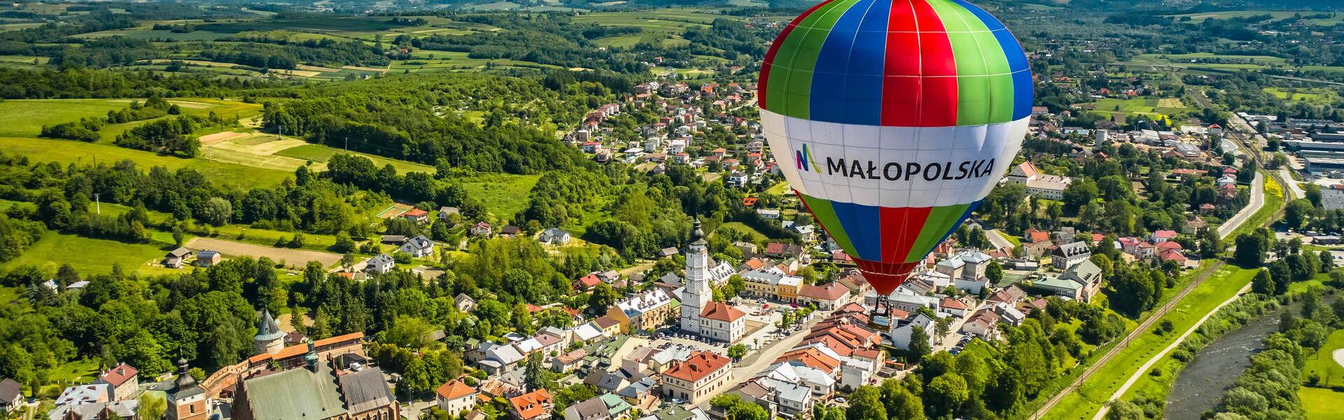 A hot air balloon above the town of Biecz